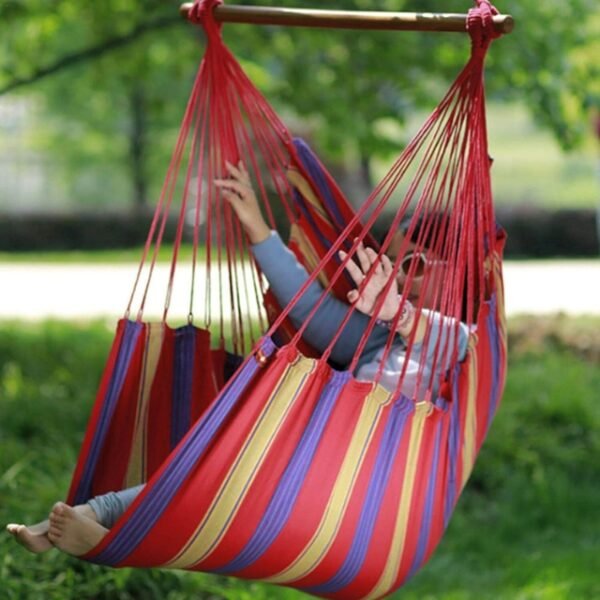 Red Hammock with Child Enjoying in Garden. Suitable for Kids and Adults.