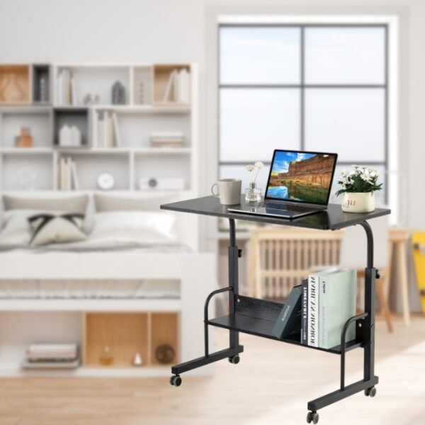 Laptop on laptop desk table with books on storage rack.