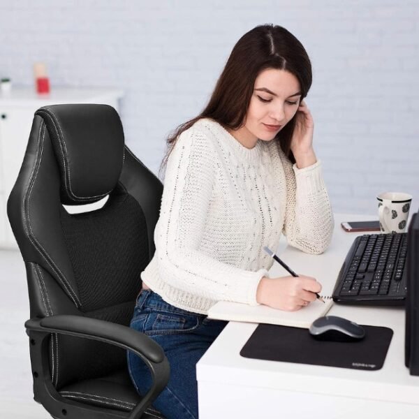 Female Office Worker Seated Comfortably on BASETBL Chair.