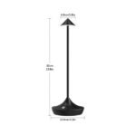 Compact black cordless table lamp with portable design.
