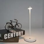 Minimalist white lamp with a triangular head and slim body, ideal for any decor.