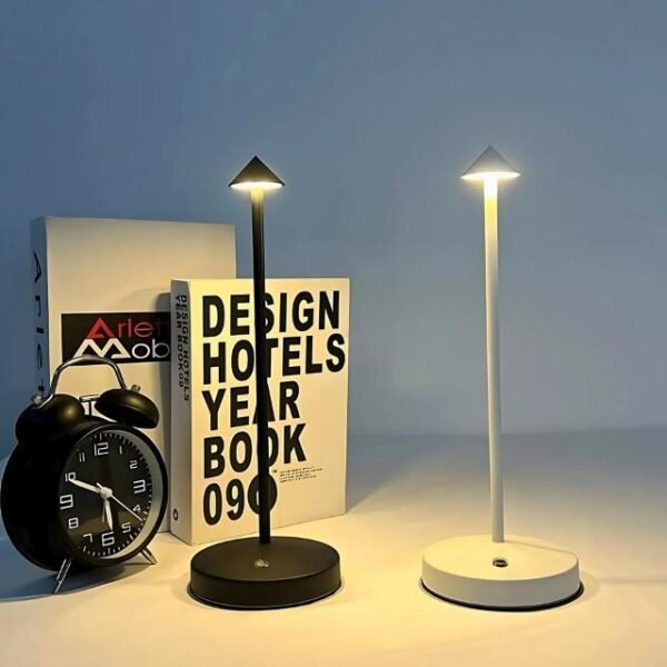 Black and white minimalist table lamps by books for a stylish touch.