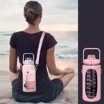 Beachgoer enjoying convenience of 2L water bottle worn on the back.