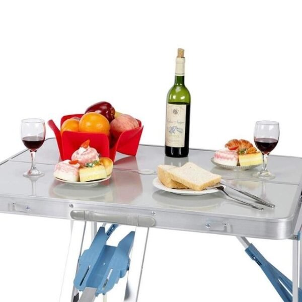 Elegant picnic table adorned with confections, fruits, and wine.