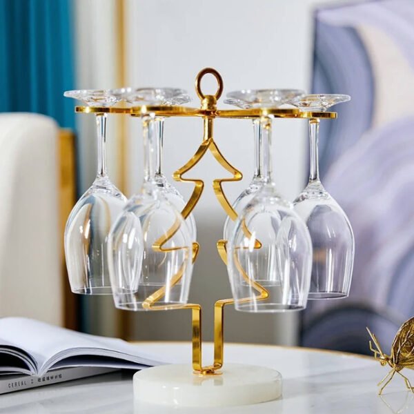 Christmas tree glass holder in gold holding six wine glasses with jade base.