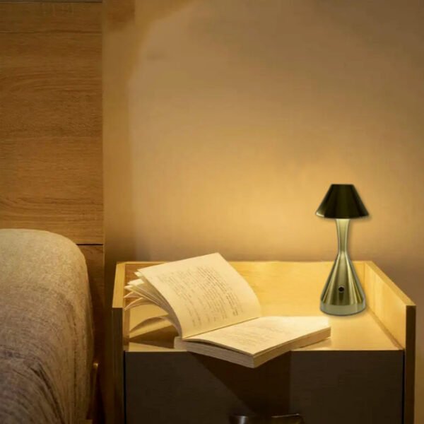 Bronze conical table lamp on bedside table with 3-level adjustable brightness.