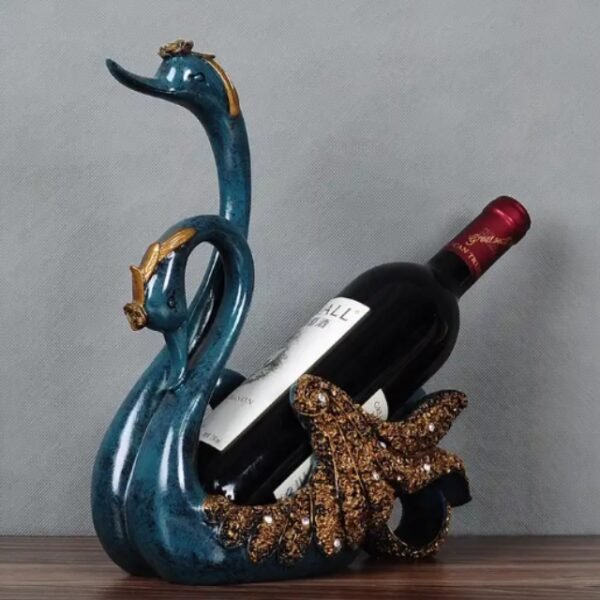 Blue Couple Swan Wine Holder on a wooden counter in a dark setting, premium materials.