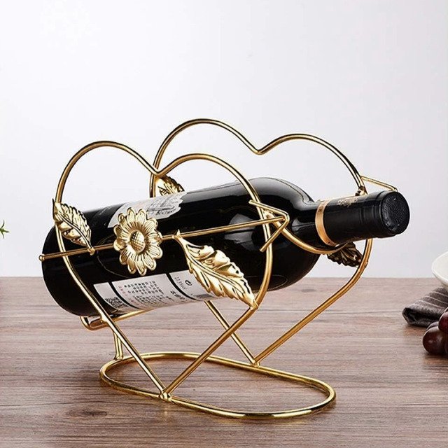 Front view of cupid wine rack with arrows holding a wine bottle.