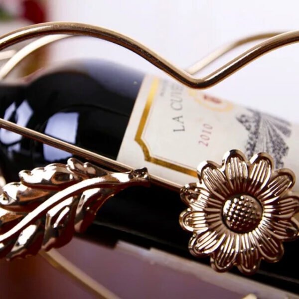 Close-up of cupid wine rack’s detailed floral design and heart shapes.