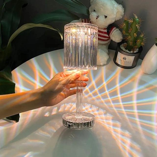 Woman Demonstrating Diamond Table Lamp's Brilliant Light