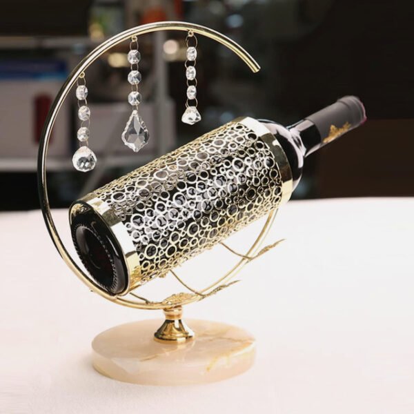 Diamond wine rack with dangling crystals shining on a countertop.