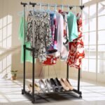 Double Pole Clothes Rack showcasing its strength by holding elegant garments. Caption: Strong and Stylish - Our Double Pole Clothes Rack!