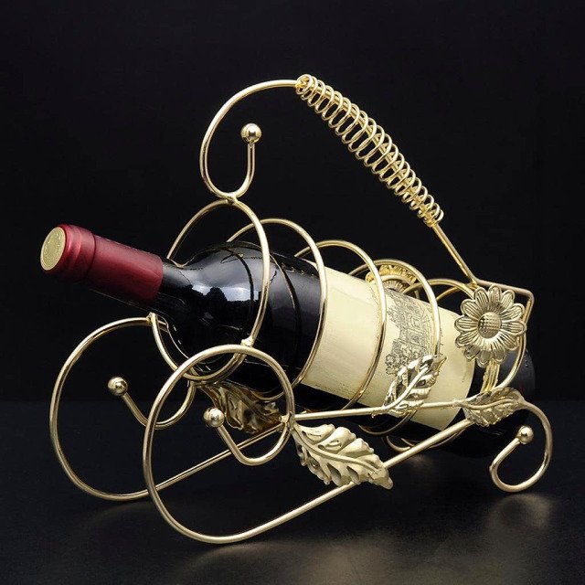 Golden floral wine bottle holder making a great impression among wine enthusiasts.