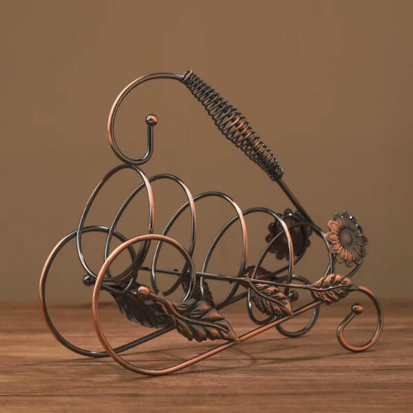 Bronze floral wine bottle holder showcasing intricate design and accents.