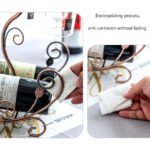 Vine wine rack with electroplated metal for durability and corrosion resistance.