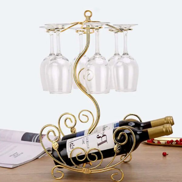 Golden vine wine rack on table holding two bottles and six glasses with vine design.