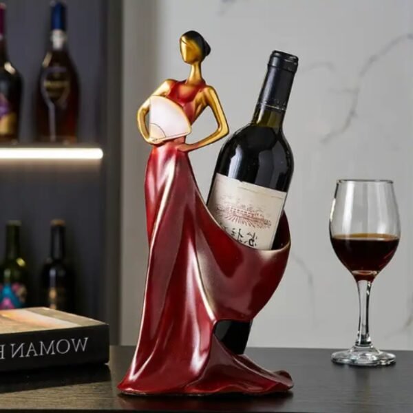 Durable red Lady of Pearls wine holder on a countertop holding a wine bottle.