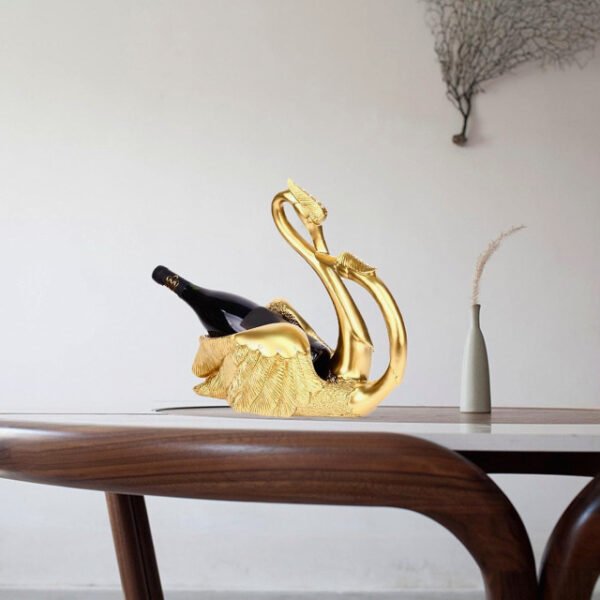 Gold love swans wine rack holding champagne on living room table.