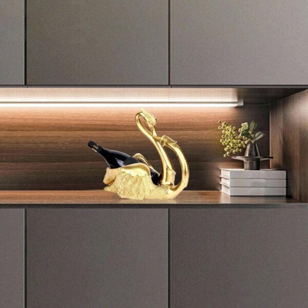 Golden love swans wine rack reflecting stylishly in modern decor.