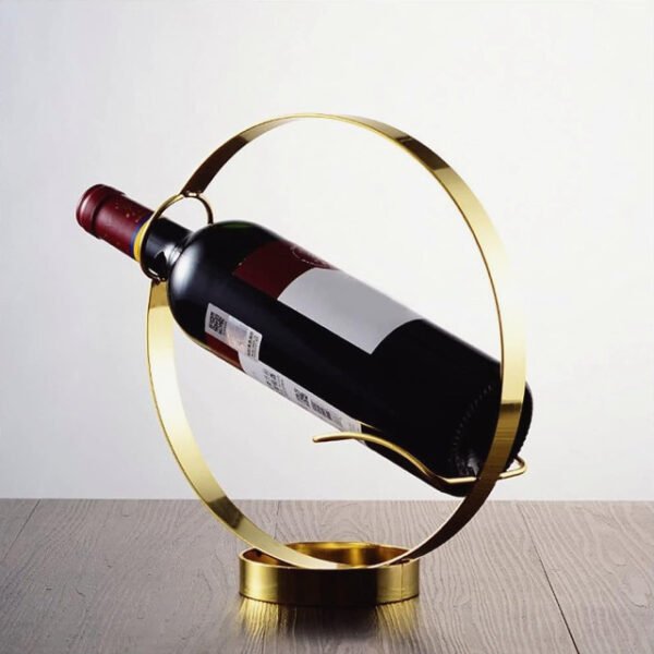 Round wine bottle holder placed stylishly on wooden counter holding a wine bottle.