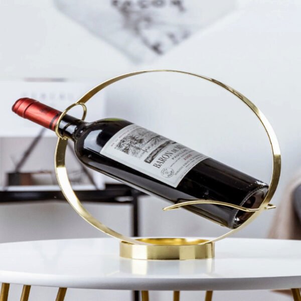 Round wine bottle holder decoratively placed on table with a wine bottle.