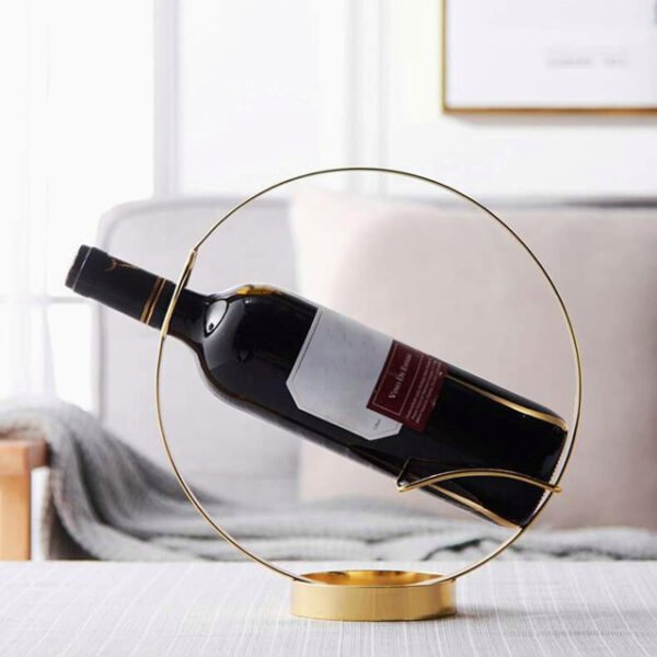 Round wine rack holding a bottle on living room table with modern design.