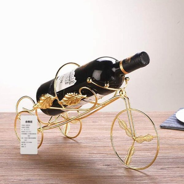 Tricycle wine rack with two rear wheels and one front wheel holding a wine bottle in Scandinavian style.