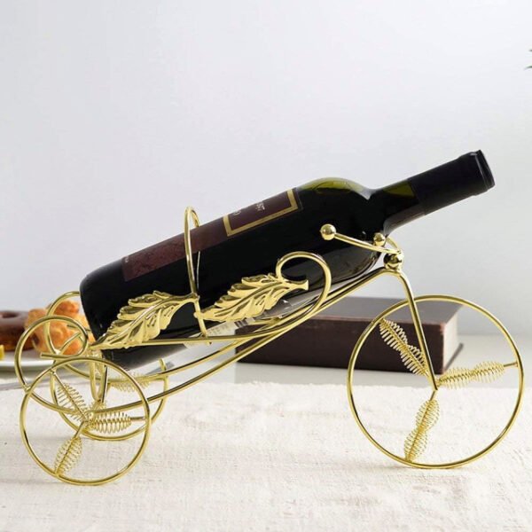 Tricycle wine holder securely holding a wine bottle on a dining table.