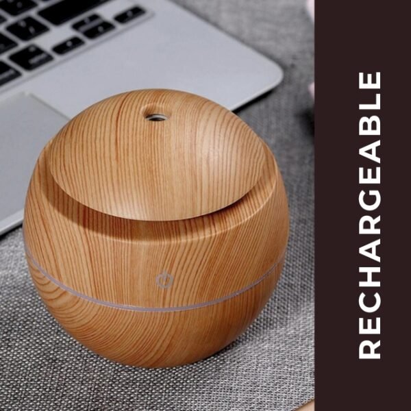 Convenient USB rechargeable light brown air freshener by a laptop.