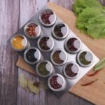 Magnetic Spice Holders on Stainless Steel Cutting Board.