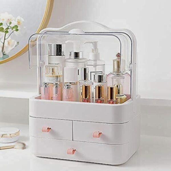 White makeup storage box on a modern counter, large compartment, three drawers.