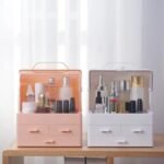Pink and white makeup storage boxes side by side, complement any taste, keep beauty kit organized.