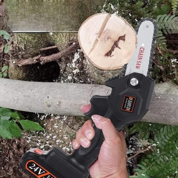 Mini cordless chainsaw efficiently chopping a tree in two.