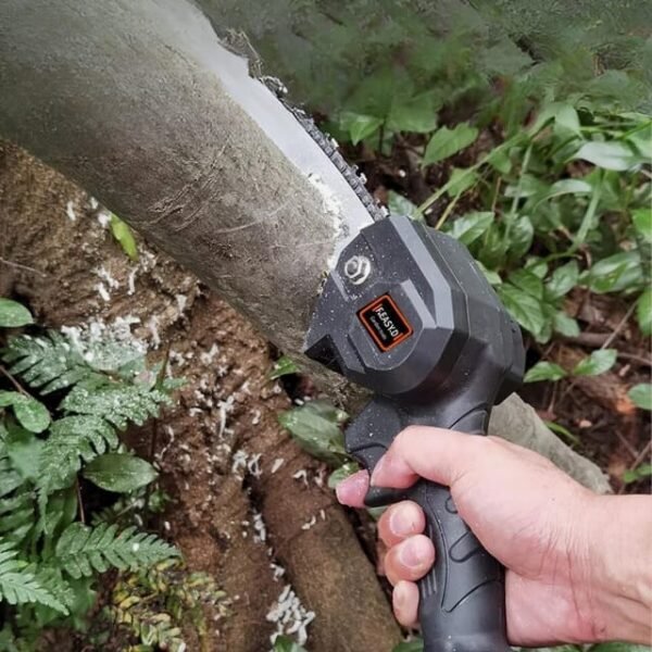 Mini cordless chainsaw effortlessly cutting a wooden branch.