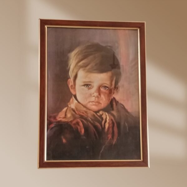 Melancholic child painting on wall with brown and gold-striped border.