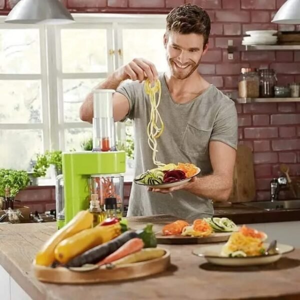 Happy Man Uses Silvercrest Spiral Slicer in Kitchen with 1.25L Veggie Container.