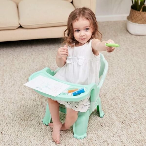 Child drawing on high chair with a convenient tray.