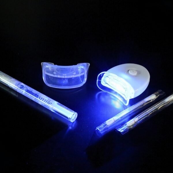 Dental White Teeth Kit with mouthpiece, vitamin E swabs, and whitening gel.