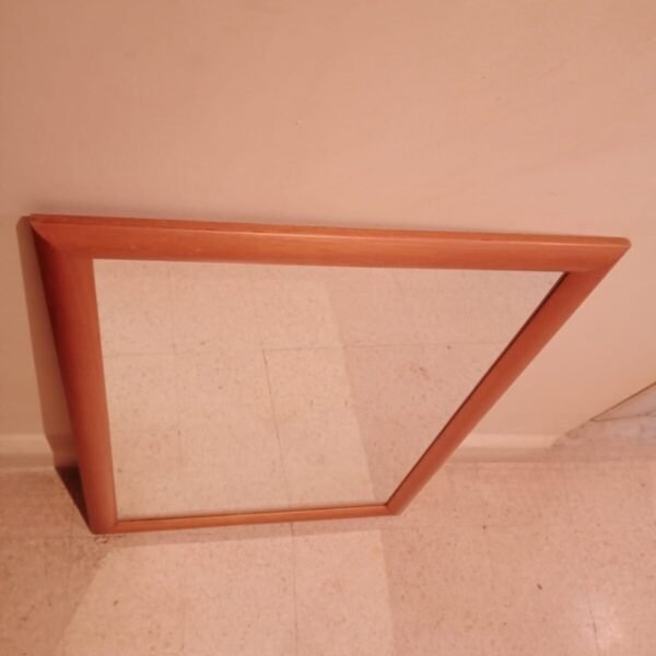 Household mirror with wooden frame view from top