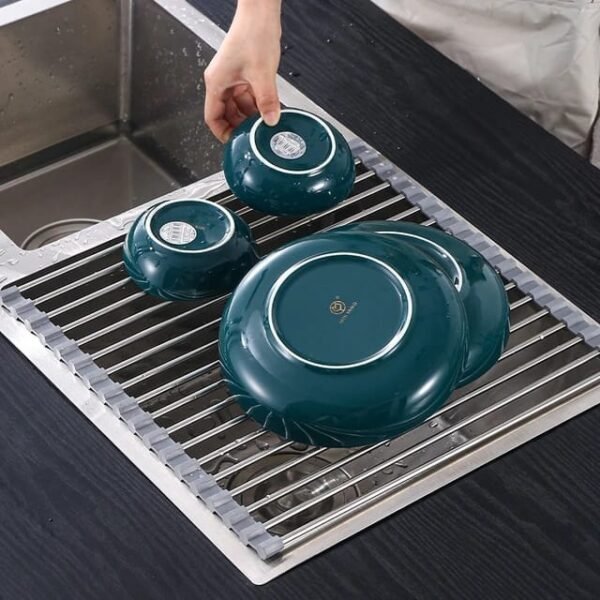 Kitchen setting with our multifunctional stainless steel draining rack for drying dishes.