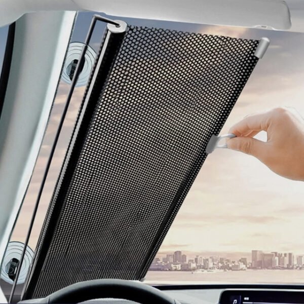 Sunshade blackout curtain rolled by man, blocks harmful UV rays.