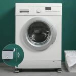 Furniture mover rails holding washing machine. Sturdy metal construction, max 150 kg weight.