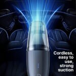 Compact Dust Cleaner with Strong Suction for Spotless Car Interiors.