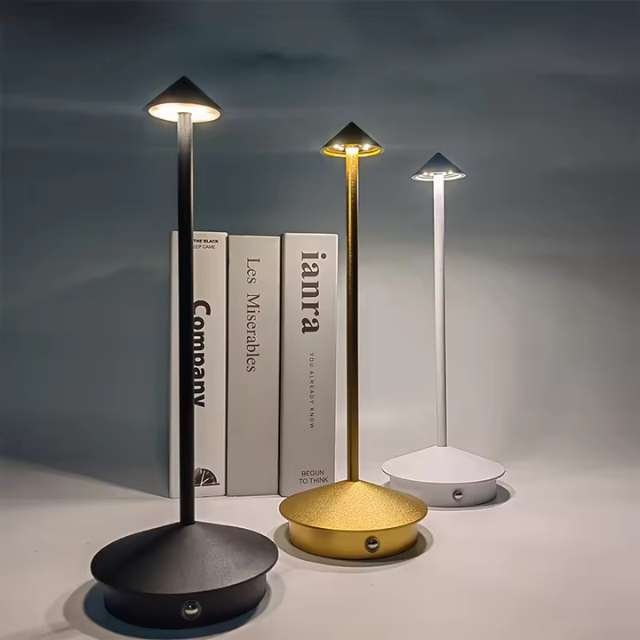Gothic-style table lamps in black, gold, and white shining brightly.