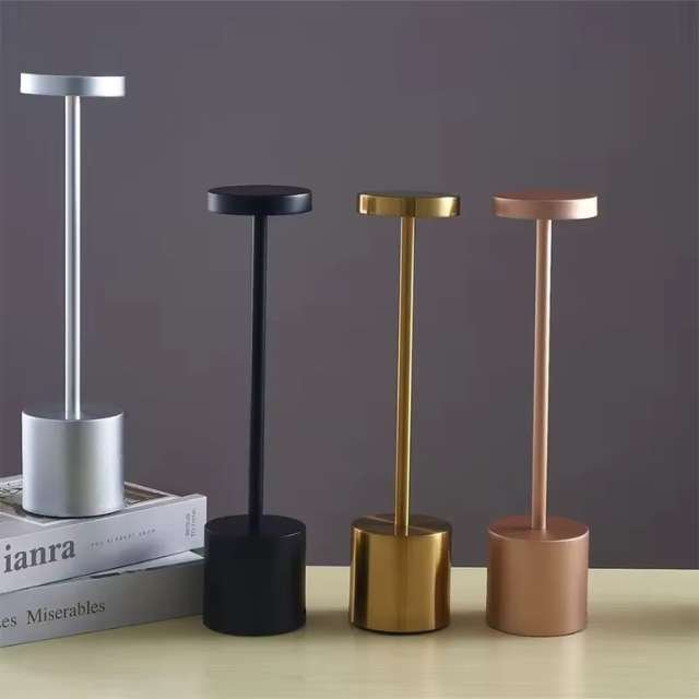 Minimalist table lamps in black, rose gold, and silver for home decor.