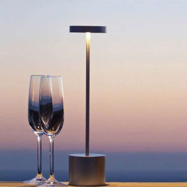 Stylish table lamp illuminating romantic night on dining table.