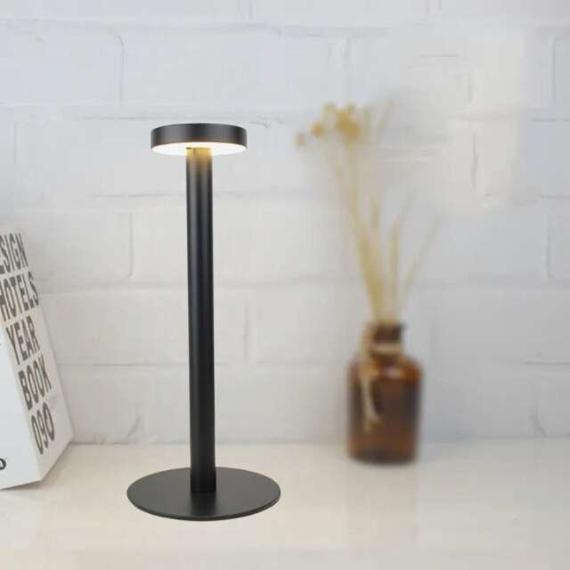 Stylish black table lamp with sleek design and 3 lighting modes.