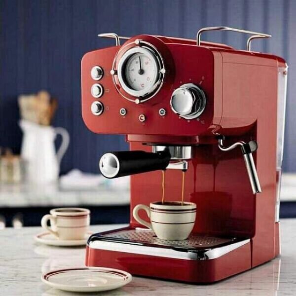 Ikohs espresso coffee machine in red on kitchen table.