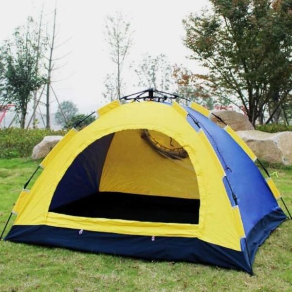 Yellow and blue portable camping tent in nature.