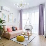 Beige swing hammock chair in living room complementing any decor.